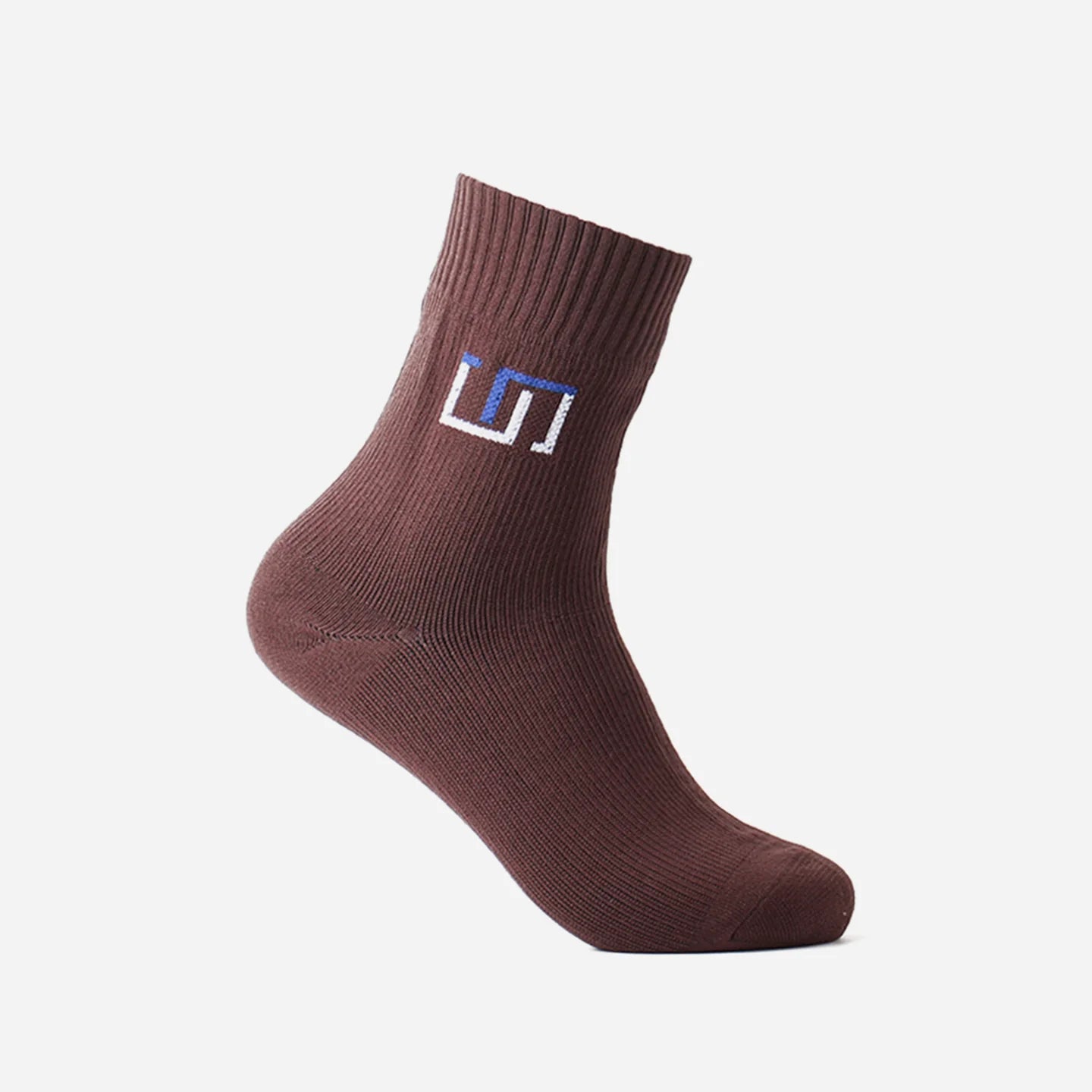 a classic brown wudhu sock with The Wudhu Socks logo in blue on the upper part