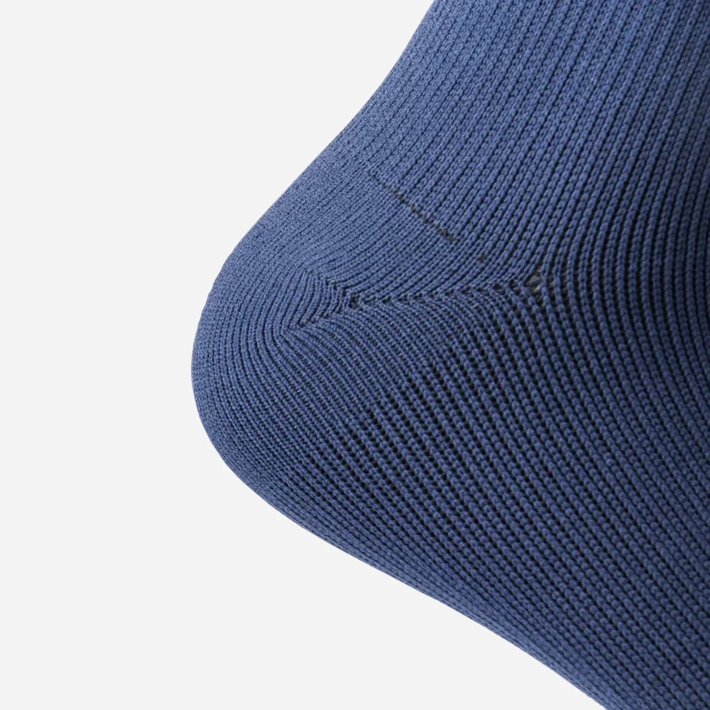 a close up view of navy blue wudhu socks wore on heel