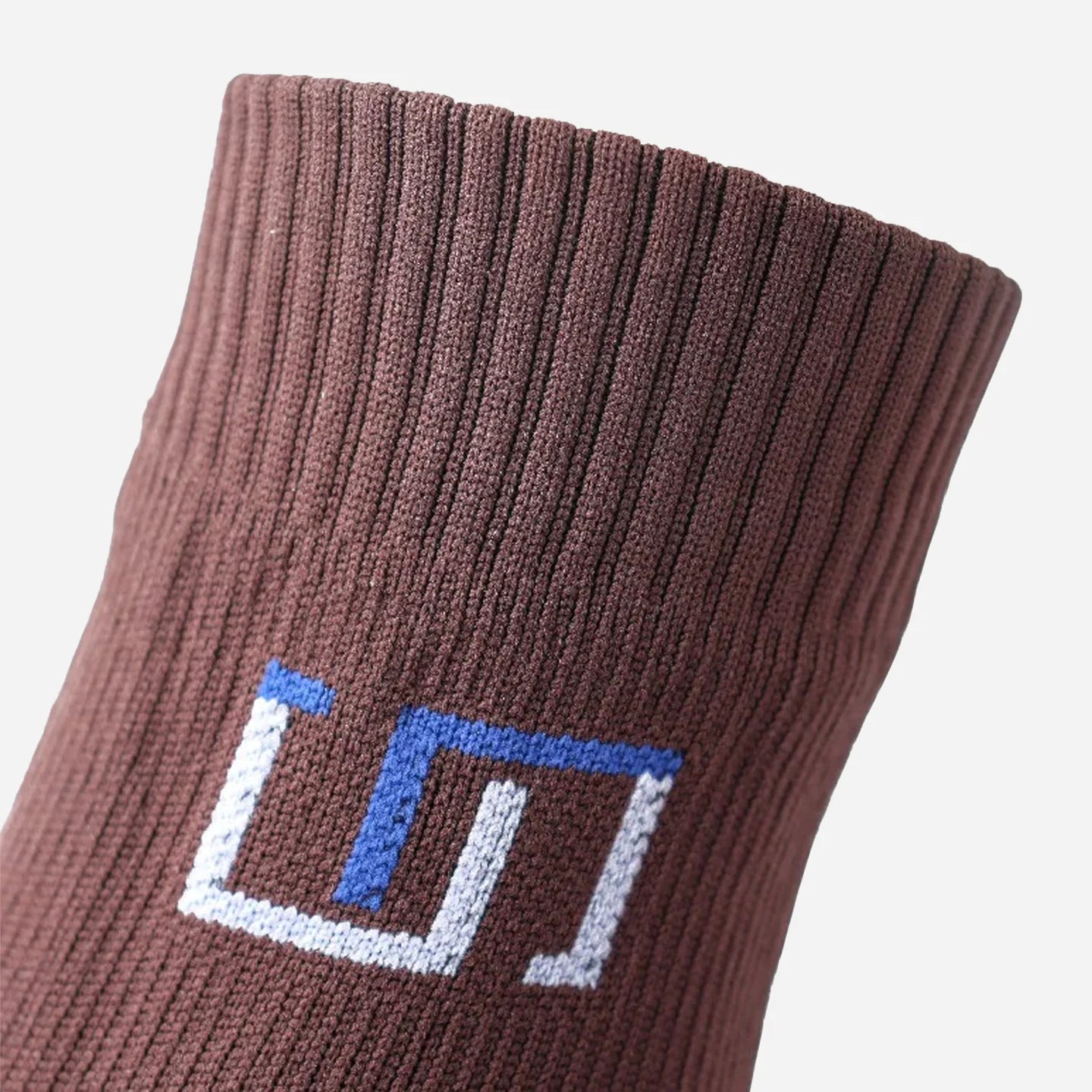 a close up view of logo on classic brown sock