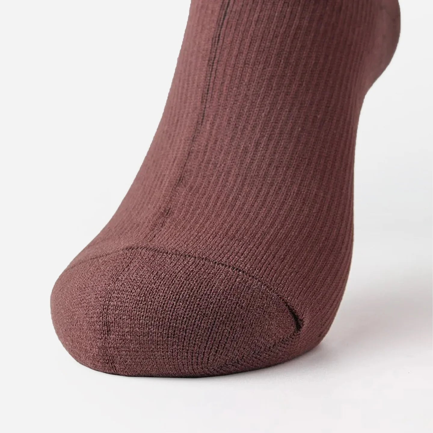 close-up of a classic brown sock on a foot from front