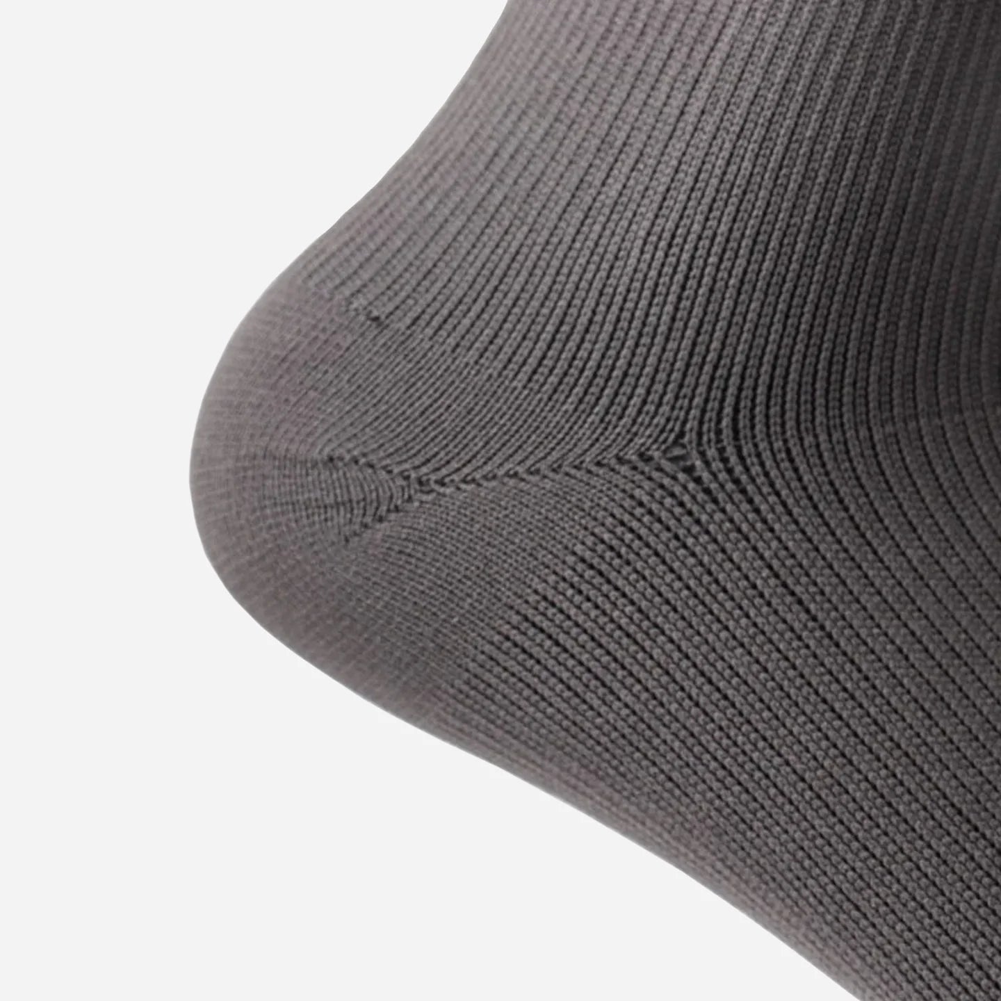 a close up view of stone grey wudhu socks wore on heel