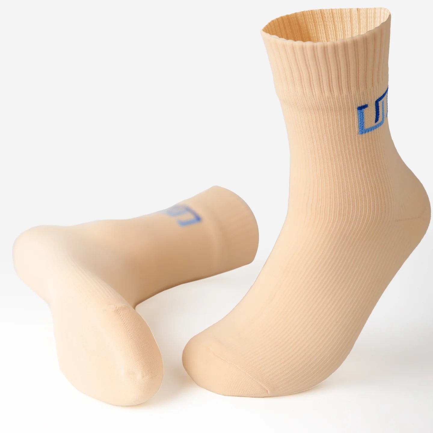 a pair of soft ivory socks