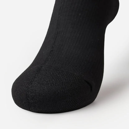 close-up of a black sock on a foot from front