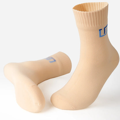 a pair of soft ivory socks